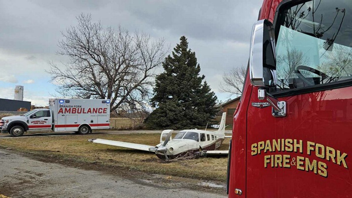 Piper Saratoga and emergency vehicles outside home