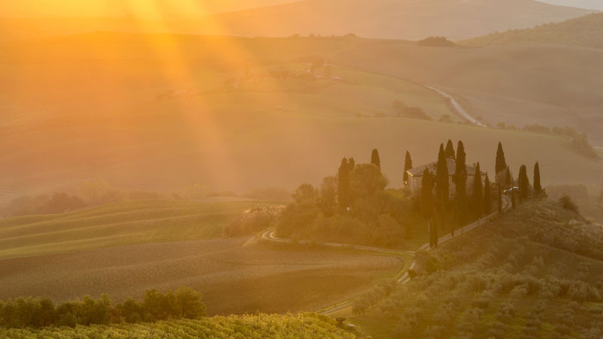 Sun rays hitting an Italian landscape