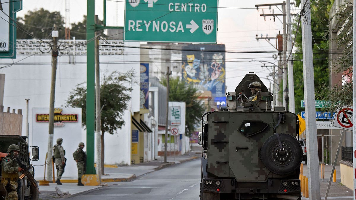 Mexican National Guard ride in cars