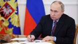 Putin sitting