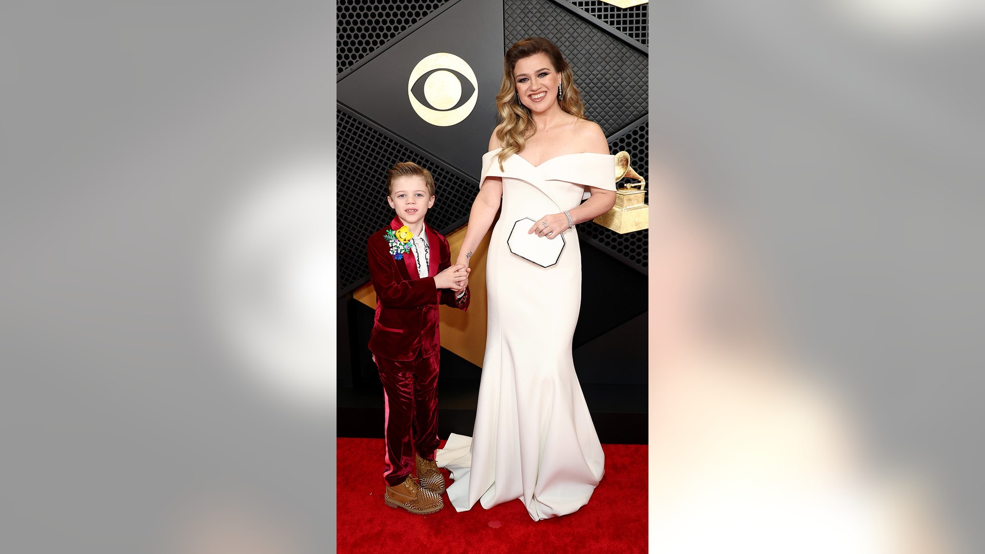 Remington Alexander and Kelly Clarkson attends the 66th GRAMMY Awards