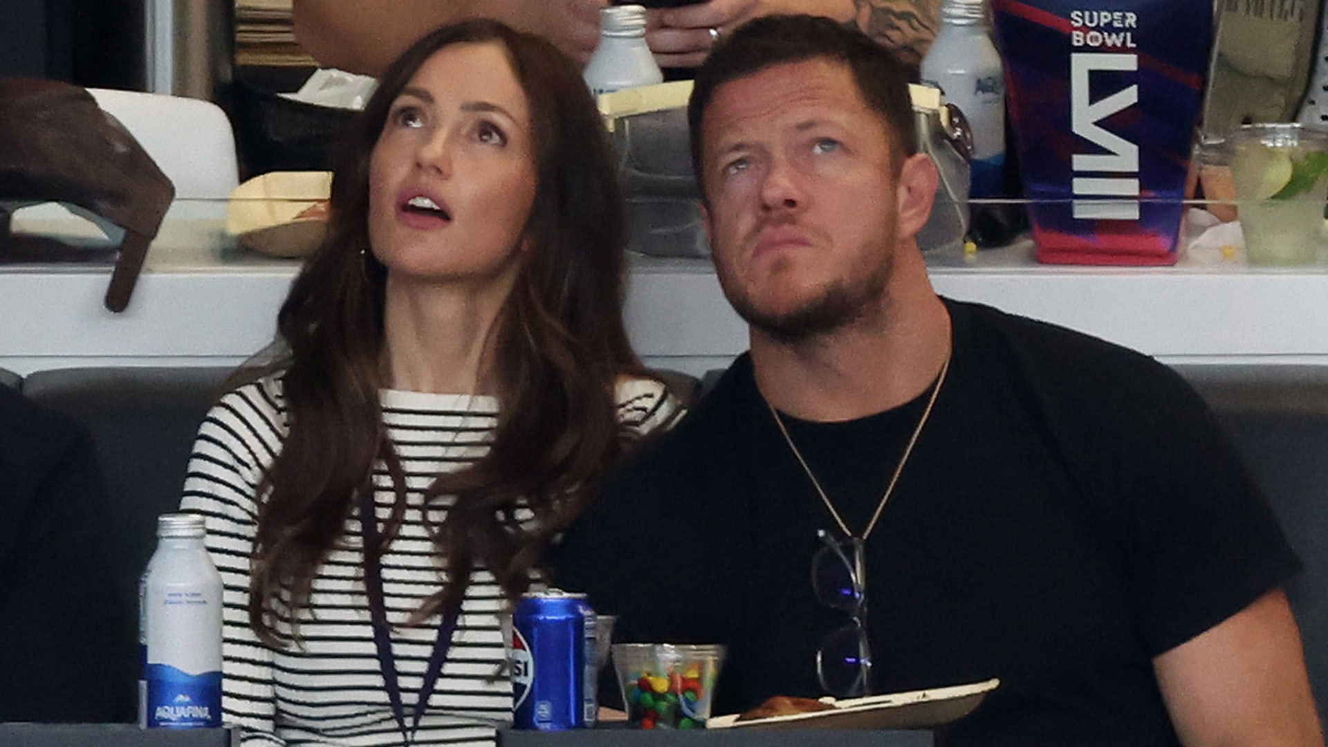 Minka Kelly and Imagine Dragons’ Dan Reynolds look on in the first quarter during Super Bowl LVIII
