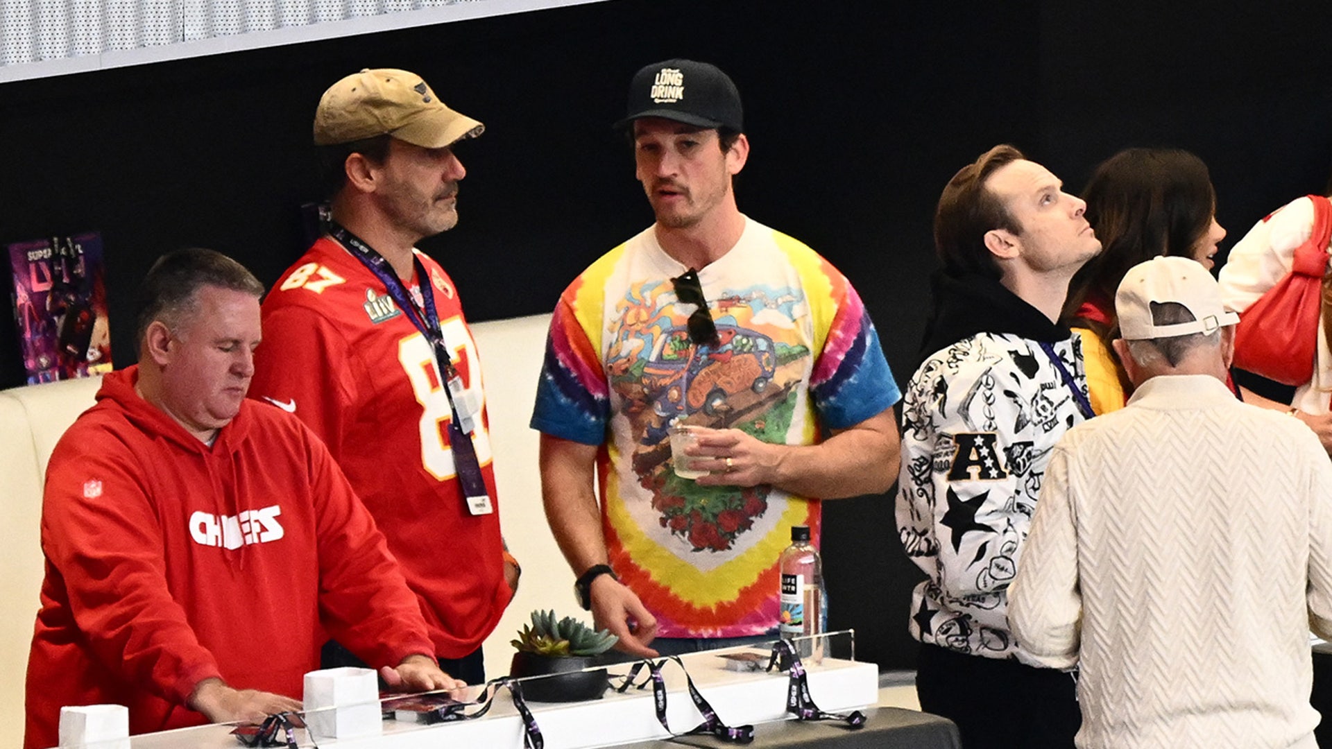 Jon Hamm and Miles Teller attend Super Bowl LVIII