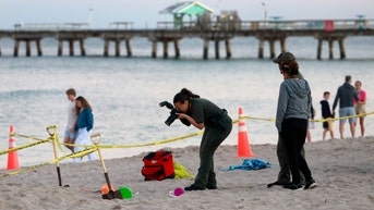 Girl buried alive while digging a hole in the sand in Florida, brother injured