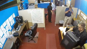 Kansas reporter sues town, local officials over police raid of newspaper office