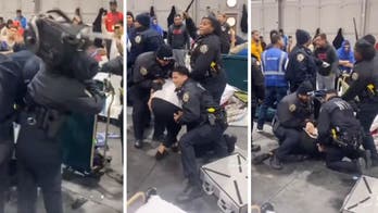 Migrants hurl bottles, backpacks at NYPD during shelter fracas