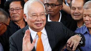 Malaysia halves prison term for ex-Prime Minister Najib Razak in corruption case