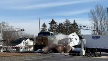 Video captures Ohio driver escaping moments before train slams into truck