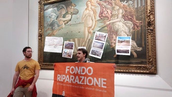 Climate activists in Italy cover Botticelli's 'Birth of Venus' with pictures of flood damage