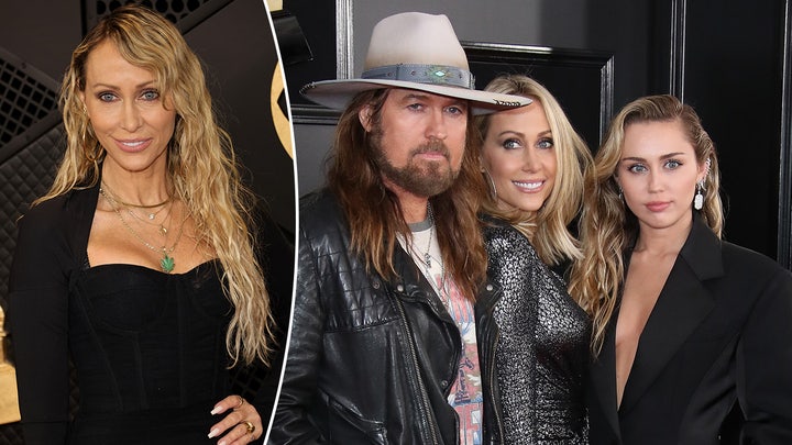 Miley Cyrus walks the red carpet at the Grammys in gold