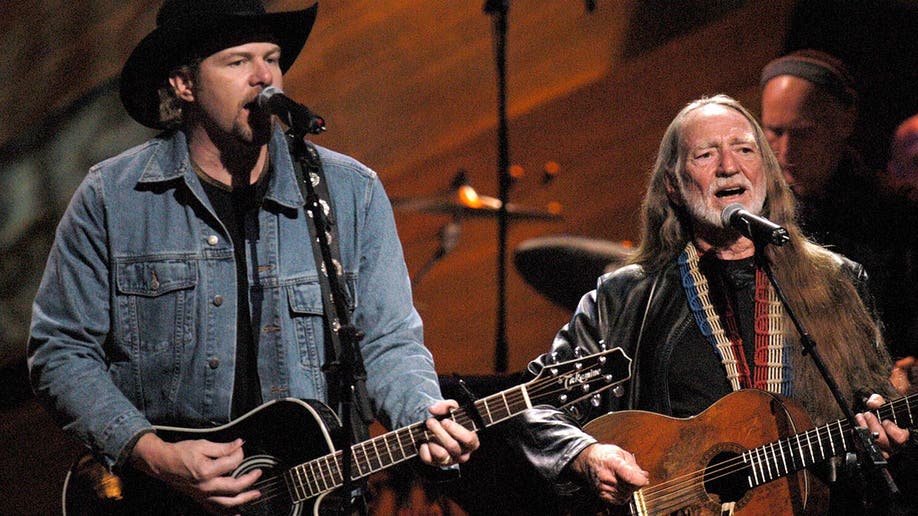 Toby Keith performs with Willie Nelson