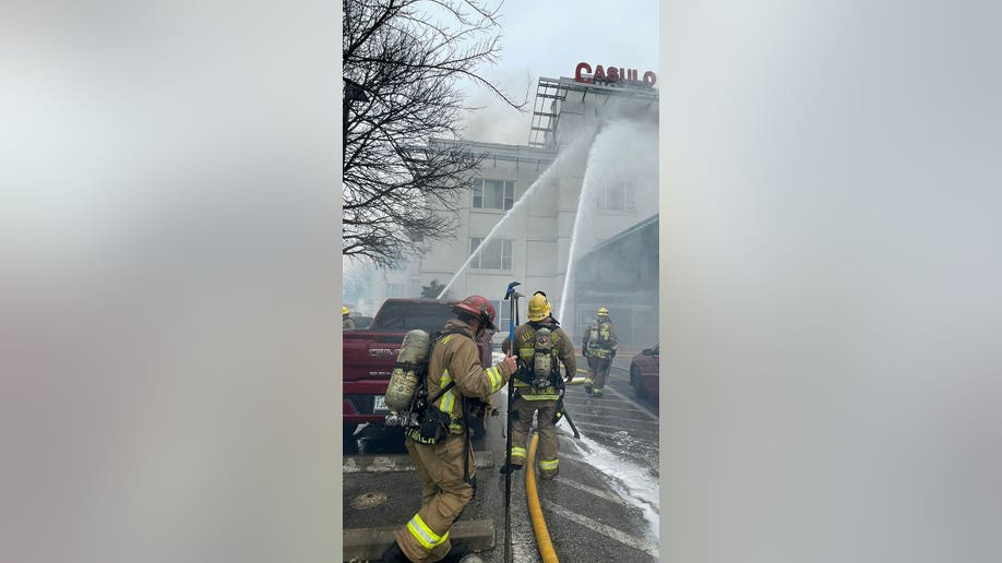 Firefighters in Austin outside building