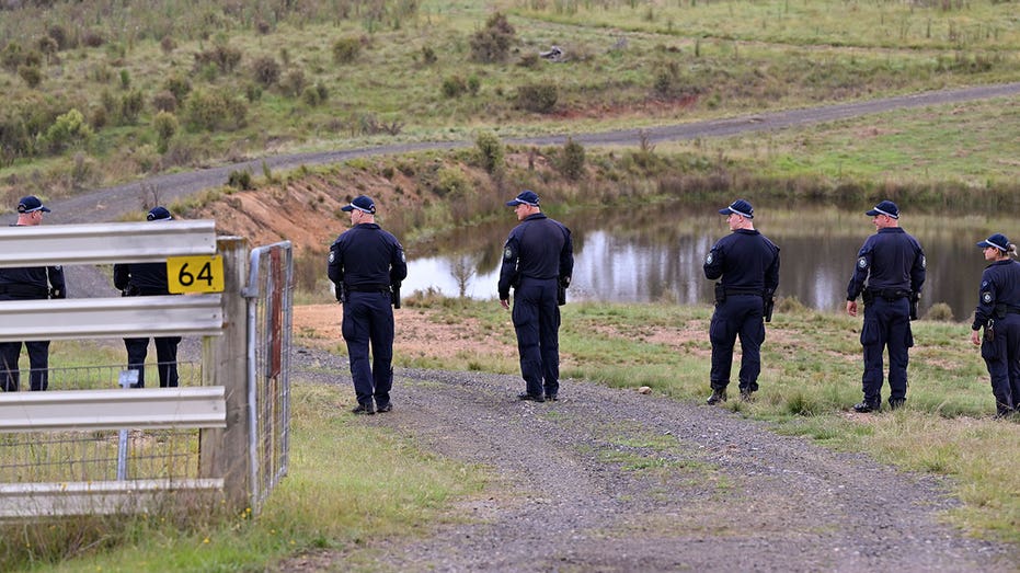 Divers search for bodies of Australian couple allegedly shot by police officer