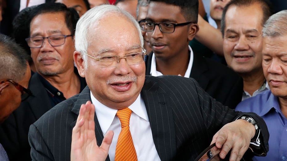 Malaysia halves prison term for ex-Prime Minister Najib Razak in corruption case