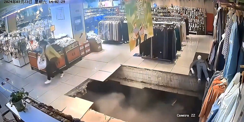 WATCH: Woman falls through floor as possible sinkhole opens up under shopping mall - Vimarsana News