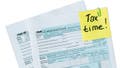Post-it note on tax documents