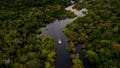 Aerial view showing a boat speeding on the Jurura river in the municipality of Carauari, in the heart of the Brazilian Amazon Forest, on March 15, 2020. - Many young people in the heart of the Amazon rainforest choose their community over the city.
