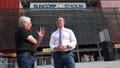 Suncorp Stadium general manager Alan Graham, left, and Queensland state Premier Steven Miles stand in front of the stadium in Brisbane, Australia, Monday, March 18, 2024. Brisbane Olympics organizers have scrapped plans to demolish and rebuild an iconic cricket ground as the centerpiece of the 2032 Games while also rejecting a review panel's recommendation for a new stadium in city parklands.