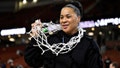 Head coach Dawn Staley of the South Carolina Gamecocks wears the net after their win over the LSU Lady Tigers following the championship game of the SEC Women's Basketball Tournament at Bon Secours Wellness Arena on March 10, 2024 in Greenville, South Carolina.
