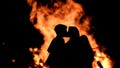 Two people kiss next to of the bonfire on the Poniente beach in Gijon, Spain, on June 24, 2017.
