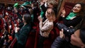 French lawmakers celebrate after they approved a bill that will enshrine a woman&rsquo;s right to an abortion in France's constitution, at the Palace of Versailles, Monday, March 4, 2024 in Versailles, west of Paris.