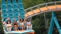 Parkgoers ride a roller coaster at Six Flags over Georgia, where
