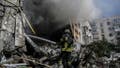 A firefighter extinguishes a fire after a flat was hit by a missile strike in Bakhmut, Donetsk region, on September 15, 2022, amid the Russian invasion of Ukraine. Thick white smoke, visible for miles around, rises over Bakhmut: this Ukrainian-controlled town in the Donbas is still under Russian offensive pressure despite the retreat of Moscow's troops in the northeast. (Photo by Juan BARRETO / AFP) (Photo by JUAN BARRETO/AFP via Getty Images)