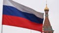 A Russian national tricolor flag flies in the wind in front of St. Basils Cathedral in central Moscow on March 15, 2024, the first day of voting in the three-day presidential election.