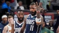 Dallas Mavericks guard Kyrie Irving (11) reacts as teammate Tim Hardaway Jr. runs up after Irving scored the game-winning shot ending the second half of an NBA basketball game against the Denver Nuggets in Dallas, Sunday, March 17, 2024.