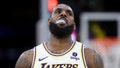 LeBron James #23 of the Los Angeles Lakers looks on during a timeout as officials attempt to fix the shot clock during the second half of a game against the Golden State Warriors at Crypto.com Arena on March 16, 2024 in Los Angeles, California.