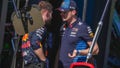 Red Bull driver Max Verstappen, right, of the Netherlands gestures as he talks with a teammate after retiring from the Australian Formula One Grand Prix at Albert Park, in Melbourne, Australia, Sunday, March 24, 2024.