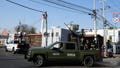 Mexican Army soldiers drive past a crime scene where a municipal police officer was shot dead, in a neighborhood of Celaya, Guanajuato state, Mexico, Wednesday, Feb. 28, 2024. In Guanajuato state, more police were shot to death in 2023 than across the United States.
