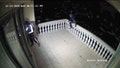 Surveillance video shows thieves climbing an upstairs balcony and breaking into a California home through a sliding door.
