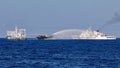 Chinese Coast Guard vessels fire water cannons towards a Philippine resupply vessel Unaizah May 4 on its way to a resupply mission at Second Thomas Shoal in the South China Sea, March 5, 2024. REUTERS/Adrian Portugal