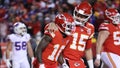 Tyreek Hill #10 of the Kansas City Chiefs celebrates with Patrick Mahomes #15 after scoring a 64 yard touchdown against the Buffalo Bills during the fourth quarter in the AFC Divisional Playoff game at Arrowhead Stadium on January 23, 2022 in Kansas City, Missouri.