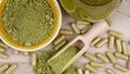 Green kratom powder, capsule and beverage still life above stock photo. Kratom herbal medicine stock images