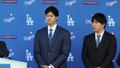 Shohei Ohtani and Ippei Mizuhara of the Los Angeles Dodgers look on during the Shohei Ohtani Los Angeles Dodgers Press Conference at Dodger Stadium on Thursday, December 14, 2023 in Los Angeles, California.