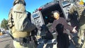 This image taken from Denver Police body camera footage provided by the American Civil Liberties Union of Colorado shows Ruby Johnson, a 78-year-old Colorado woman, surrounded by SWAT officers, Jan. 4, 2022, in Colorado. Johnson, who sued two police officers after her home was wrongly searched by a SWAT team looking for a stolen truck, won a $3.76 million jury verdict Monday, March 4, 2024, under a new Colorado law that allows people to sue police over violations of their state constitutional rights.