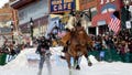 A skijoring team competes in Leadville, Colo., on Saturday, March 2, 2024. Skijoring draws its name from the Norwegian word skikjoring, meaning "ski driving." It started as a practical mode of transportation in Scandinavia and became popular in the Alps around 1900. Today's sport features horses at full gallop towing skiers by rope over jumps and around obstacles as they try to lance suspended hoops with a baton, typically a ski pole that's cut in half.
