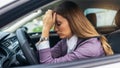 Businesswoman having headache has to make a stop after driving car in traffic jam