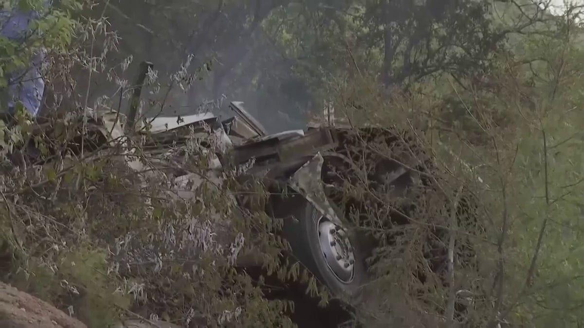 Bus Carrying Easter Travelers Veers Off Bridge, Killing At Least 45 A photo of the bus, ash
