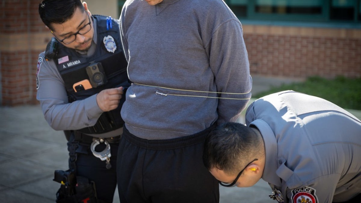 Fairfax County police in Virginia show how the hand-held restraint device called "the Bola" works.