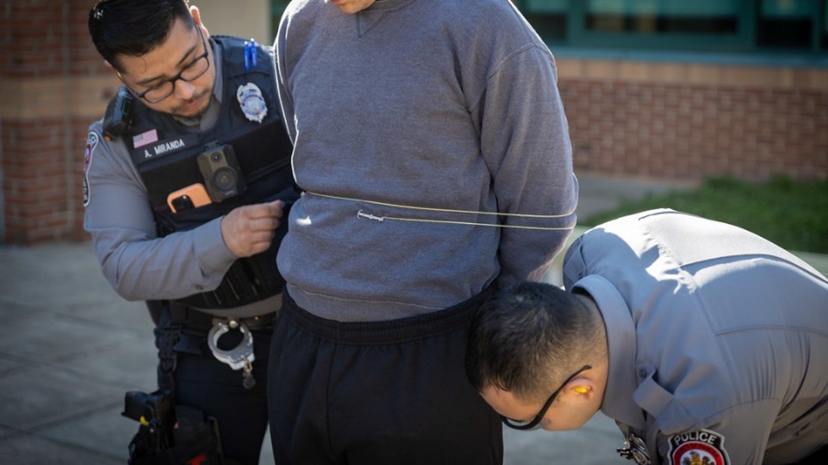 Fairfax County police in Virginia show how the hand-held restraint device called "the Bola" works.