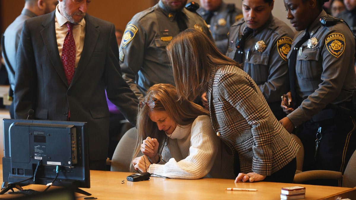 Michelle Troconis listens as a verdict of guilty on all counts is read on the final day jury deliberation for her criminal trial at Connecticut Superior Court in Stamford, Conn. Friday, March 1, 2024.