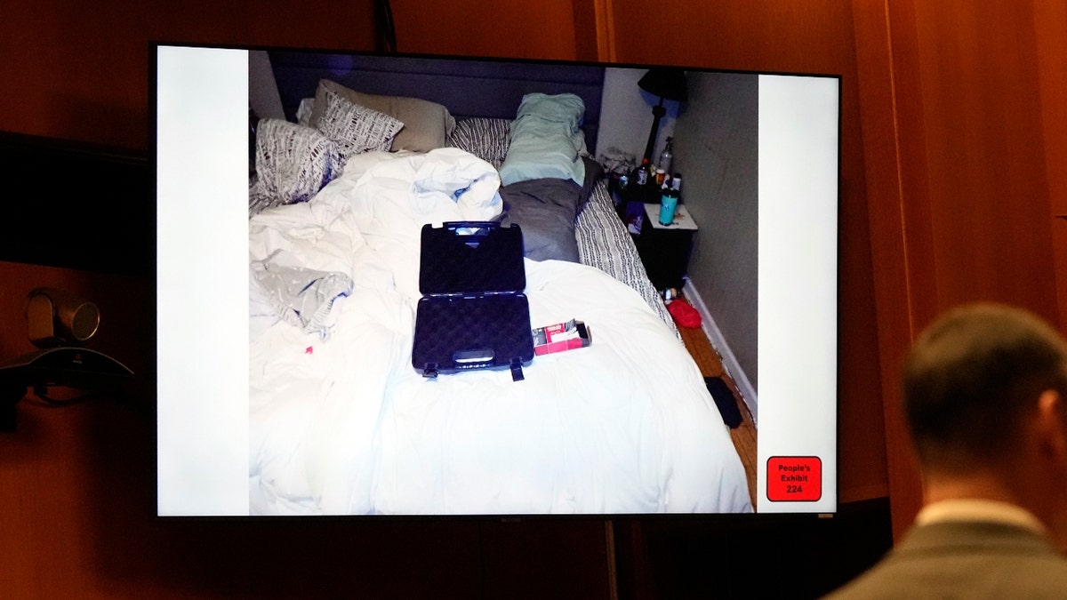 In a frame grab from video, the empty gun case and ammunition box are seen on the bed of James and Jennifer Crumbley during the trial for James Crumbley, the father of a Michigan school shooter, Tuesday, March 12, 2024 in Pontiac, Mich.