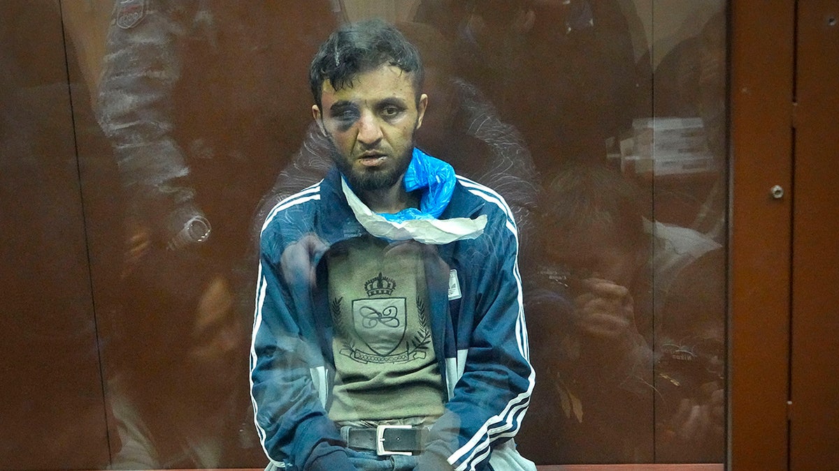 A suspect in the Crocus City Hall shooting on Friday sits in a courtroom in the Basmanny District Court, in Moscow, Russia, Sunday, March 24, 2024.