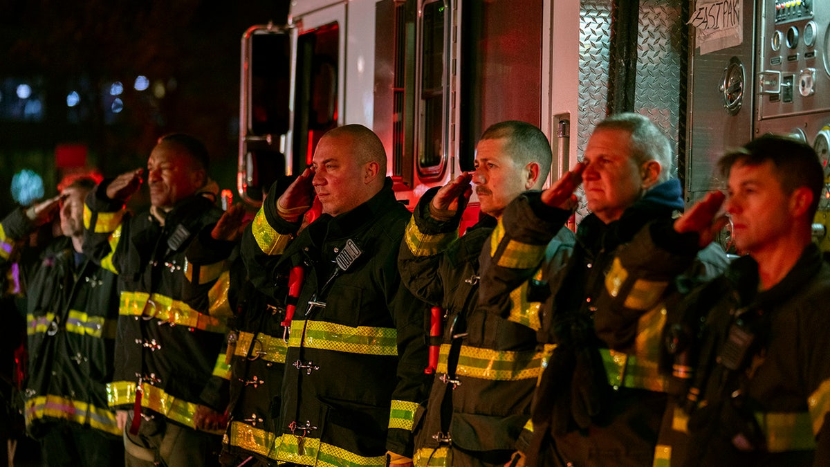 Firefighters salute ambulance transporting Diller