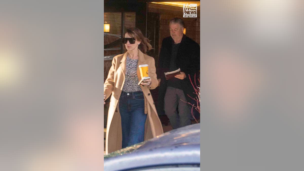 Alec Baldwin, who faces charges of involuntary manslaughter, leaves his apartment buiding with wife, Hilaria Baldwin