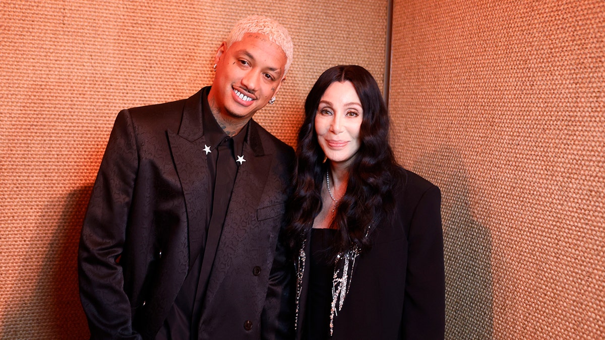 Alexander Edwards and Cher posing together