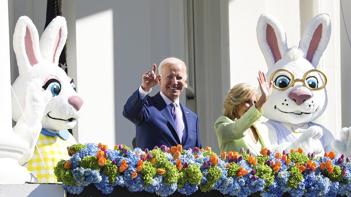 Biden and the first lady with two giant Easter bunnies